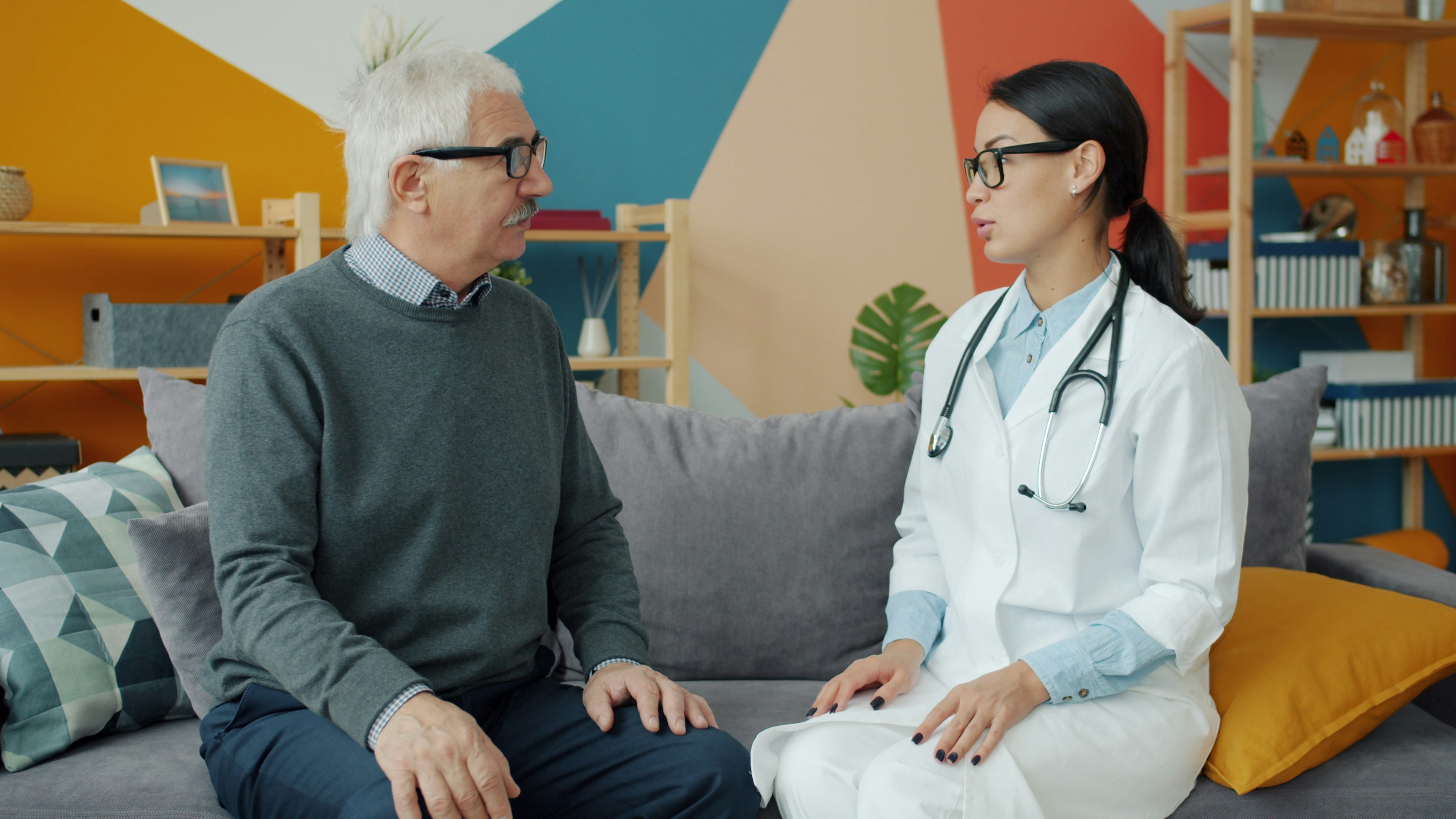 doctor giving consultation at home